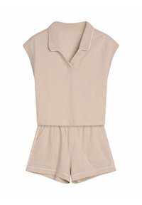 Beige two-piece outfit with a short sleeve top and shorts, featuring a v-neck collar, elastic waistband, and white piping accents.
