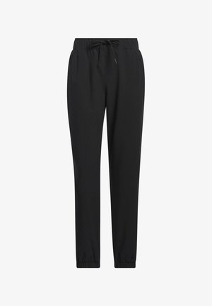 Pantalones de chándal negros hechos de una tela suave, con una cintura elástica con cordón y piernas ajustadas con puños elásticos.