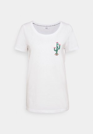 Vit t-shirt med kort ärm i bomull, med en broderad design av en kaktus med rosa blommor på vänster sida och rundad halsringning.