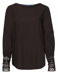 Schwarze Bluse mit langen Ärmeln und einem Bootsausschnitt, verziert mit transparenten, gemusterten Spitzenakzenten an den Manschetten, aus einem glatten Stoff gefertigt.