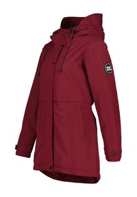 Rode waterdichte jas met een capuchon, verstelbare koordjes en drukknoopsluiting. Heeft twee voorzakken en een logo-opdruk op de mouw.