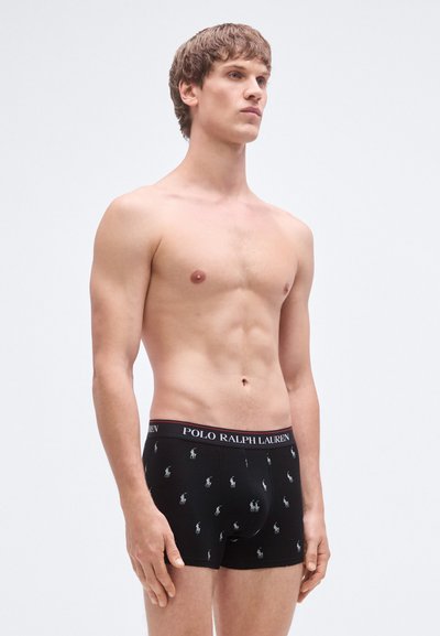 Svarte boxerbriefs med Polo Ralph Lauren-logo på linningen, med et gjentatt hestelogo-mønster i en kontrastfarge.