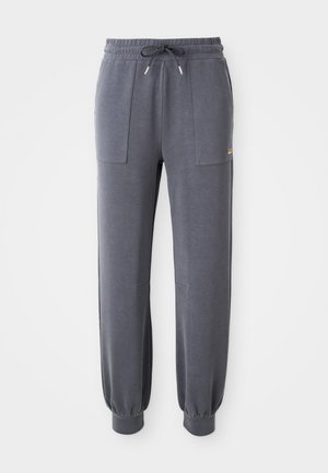 Grijze joggingbroek van zacht materiaal, met een elastische tailleband met trekkoord, twee zijzakken en taps toelopende boorden bij de enkels.