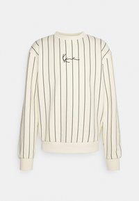 Sudadera color crema con rayas verticales negras, escote redondo y logotipo bordado en el pecho. Presenta puños y dobladillo acanalados.