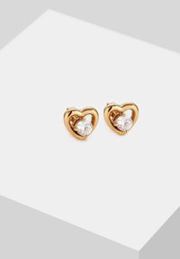 Boucles d'oreilles en forme de cœur en or avec des pierres précieuses rondes transparentes au centre, finition polie et design minimaliste.