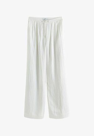 Valged lina laiade säärtega püksid tekstuurse pinnaga, millel on nööbi sulgur ja vöökoha juures voldid mugava istuvuse jaoks.