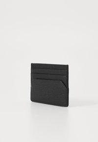 Black leather cardholder with a textured surface, featuring multiple card slots and a front pocket. Compact and minimalist design.