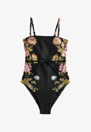 Schwarzer Badeanzug mit floralen Mustern in Rosa, Gelb und Blau, mit dünnen Trägern und einem geflochtenen Gürtel, der an der Taille gebunden ist.
