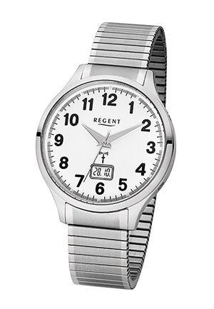 Montre-bracelet analogique argentée avec cadran blanc, chiffres noirs, affichage de la date indiquant le 28.10, et un bracelet métallique extensible.