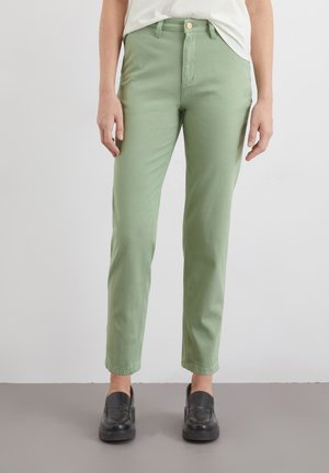 Light green cotton pants with a slim fit, featuring a button and zip closure, front pockets, and a cropped length.