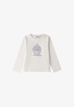 Camisa de algodón blanca de manga larga con un gráfico de cupcake en azul y rosa, que presenta el texto "dulce y delicioso" debajo. Cuello redondeado.