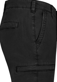 Black trousers made from a smooth, matte fabric with a slim fit. Features a front pocket and a back pocket with a horizontal flap.