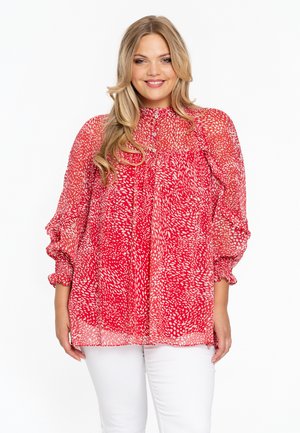 Bluse mit rotem und weißem Muster, hohem Kragen, durchgehender Knopfleiste und Puffärmeln. Das durchsichtige Material sorgt für eine leichte, luftige Textur.