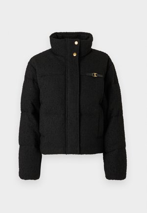 Black textured puffer jacket with high collar, snap button closure, and small gold buckle detail on the chest pocket.