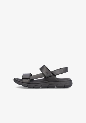 Black sandal with adjustable Velcro straps, a padded footbed, and a textured rubber sole designed for comfort and stability.