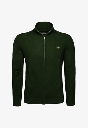 Dark green full-zip knit sweater with long sleeves, standing collar, and small embroidered logo on the left chest.