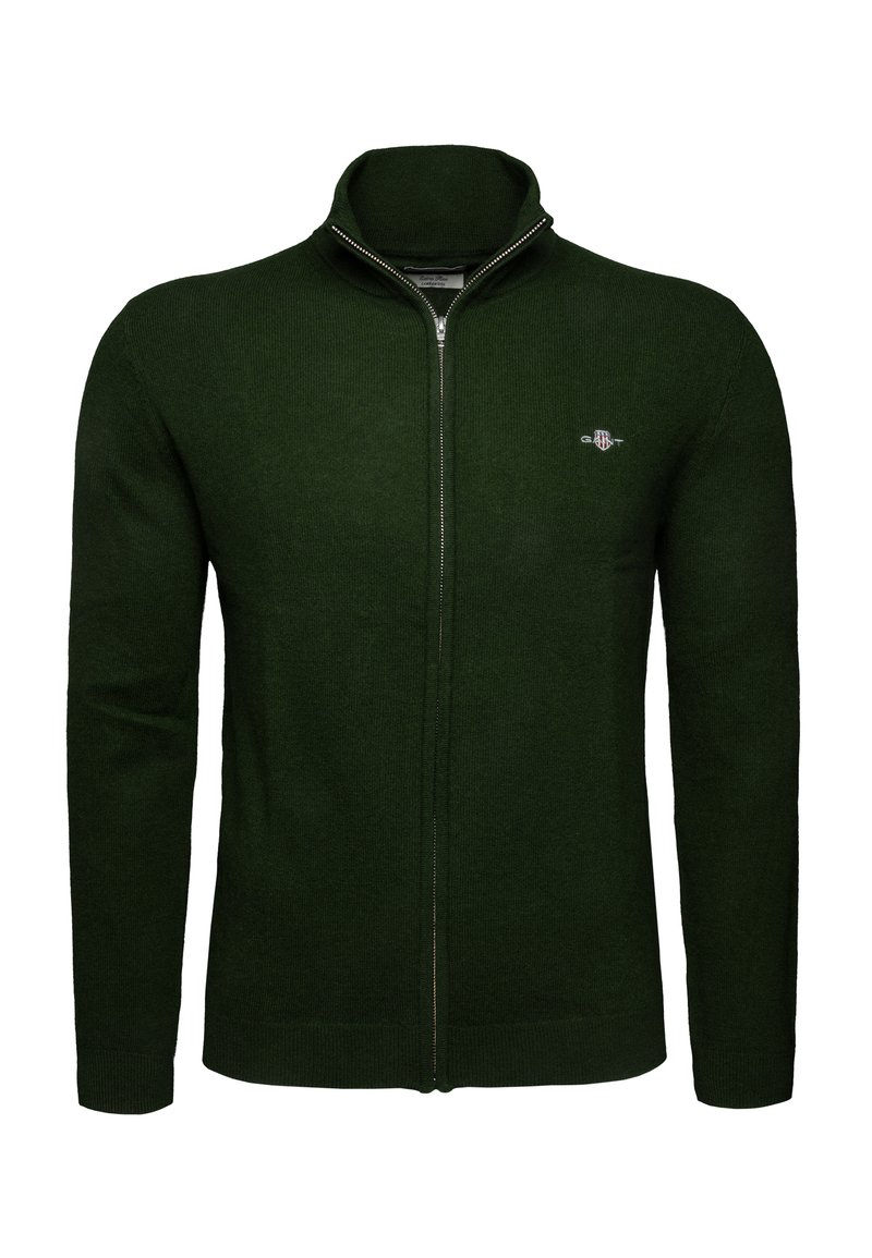 Suéter de punto de cremallera completa en verde oscuro, con mangas largas, cuello alto y pequeño logo bordado en el lado izquierdo del pecho.