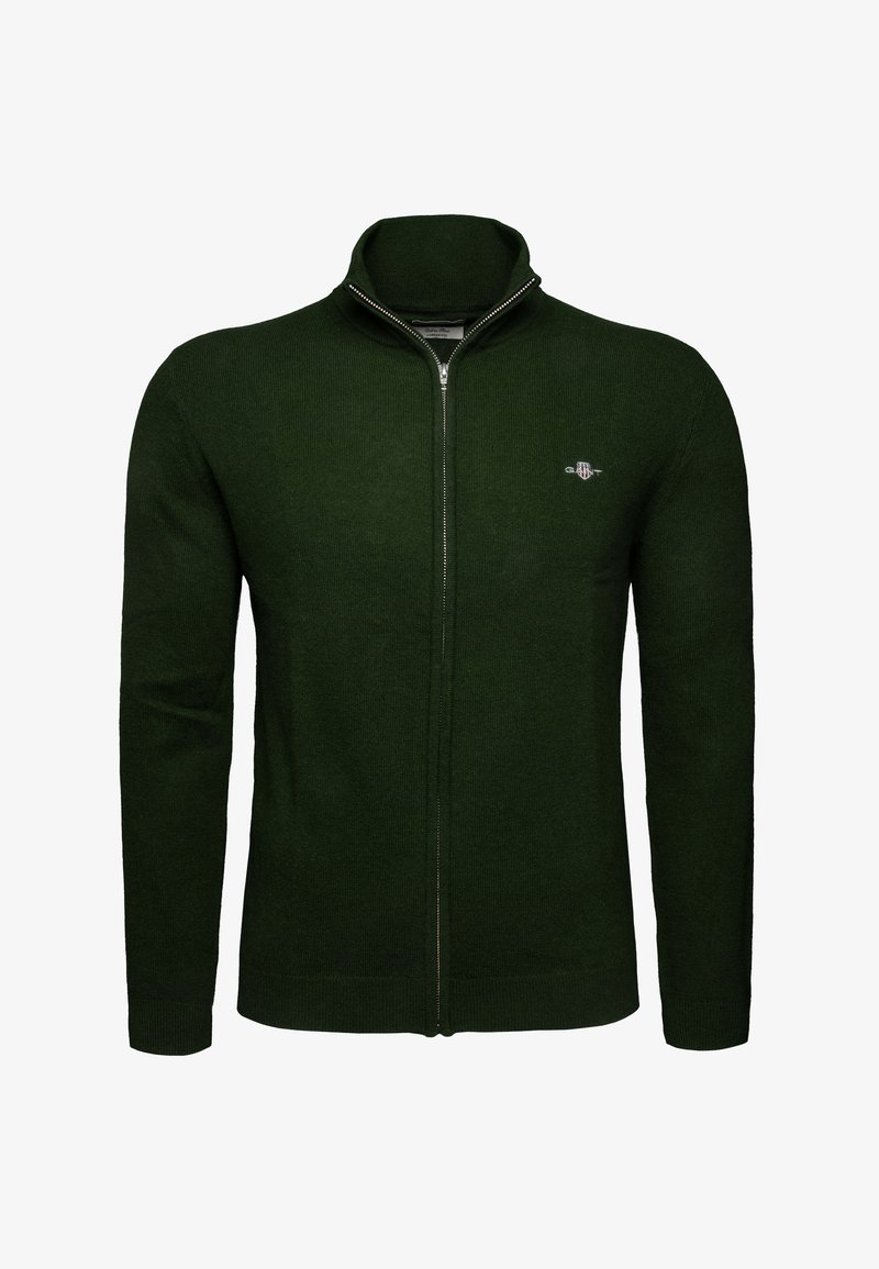 Suéter de punto de cremallera completa en verde oscuro, con mangas largas, cuello alto y pequeño logo bordado en el lado izquierdo del pecho.