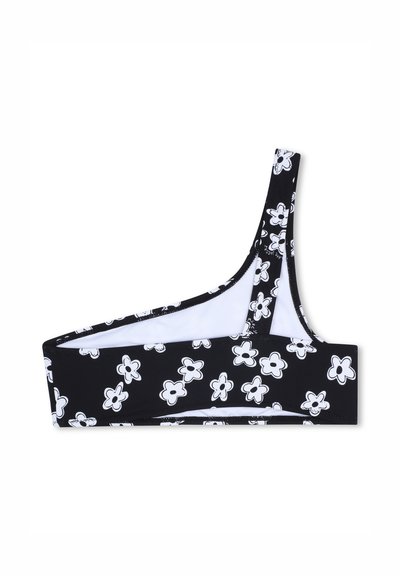 Bralette noir avec un motif floral blanc audacieux, une bretelle épaule unique et une doublure blanche. Conçu avec une coupe ajustée et sportive.