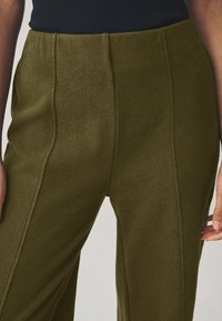 Next SUPERSOFT COSY WIDE  - Pantalones - olive green