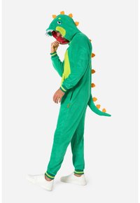 Tutina a tema dinosauro verde, con cappuccio, spine arancioni e panciera gialla. Tessuto morbido con polsini a coste e una coda sul retro.
