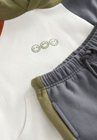 Unselected, ecru/off white and charcoal grey colourblock