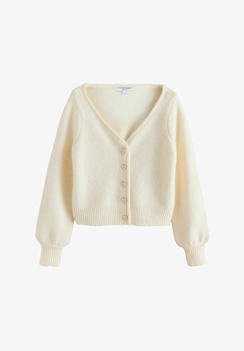 Cardigan de couleur crème en tissu doux, avec un col en V, des poignets et un ourlet côtelés, et des boutons en forme de cœur sur le devant.