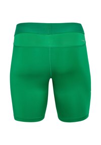 Groene sportbroekjes van soepel materiaal, met een aansluitend ontwerp en een brede tailleband met kleine perforaties voor ventilatie.