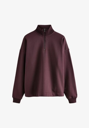 Burgundia pullover-swetšert kõrge kraega, pool tõmblukk ja soonikkoes mansetid. Pehme tekstuur ja mugav lõige. Ilma nähtavate mustrite või kujunditeta.