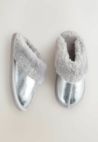 Silver metallic slippers with soft gray faux fur cuffs and a textured finish. Rounded shape and flat soles for indoor wear.