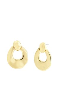 Boucles d'oreilles en métal doré présentant un design circulaire avec une forme abstraite, une texture lisse et un accent ovale en haut.