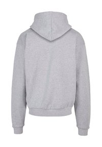 Gray hooded sweatshirt with a soft texture. Features ribbed cuffs and hem, and a spacious hood. Simple design, no visible patterns or accents.