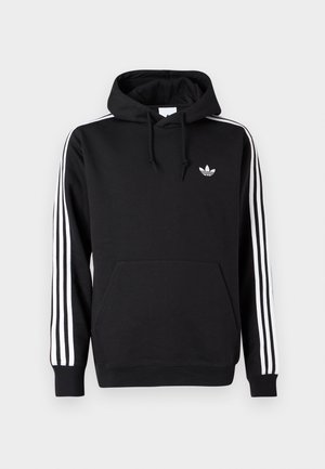 Μαύρο φούτερ με κουκούλα Adidas με λευκές τρεις ρίγες στα μανίκια, μπροστινή τσέπη, κουκούλα με κορδόνια και μικρό λευκό λογότυπο τριφυλλιού στο στήθος.