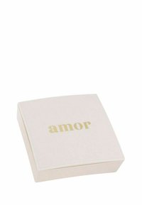 Scatola quadrata di un tenue rosa pallido con bordi arrotondati, presenta la parola "amor" in lettere dorate sulla parte superiore, con una superficie liscia e un design semplice.
