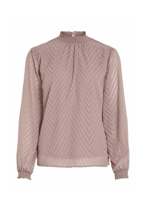 Blusa de un suave color malva con mangas largas, cuello alto fruncido y una sutil textura en forma de chevron. Tejido suave y transparente con puños fruncidos.