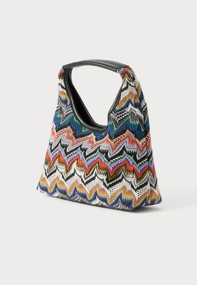 Multicolored zigzag-patterned bag made of woven fabric with a rounded top handle and a soft, structured shape. Black interior lining.