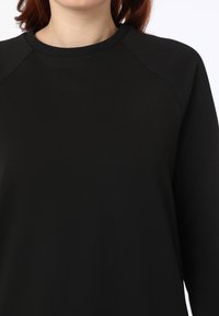 Modanisa BENIN - Pantalones deportivos - black