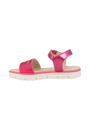 Pink sandals with a shiny patent finish, featuring a rhinestone-embellished strap and a white rubber sole. Adjustable ankle strap included.