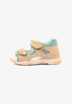 Beige en turquoise kindersandaal met open teen, voorzien van twee verstelbare klittenbandsluitingen en een gevoerde, gestructureerde zool.