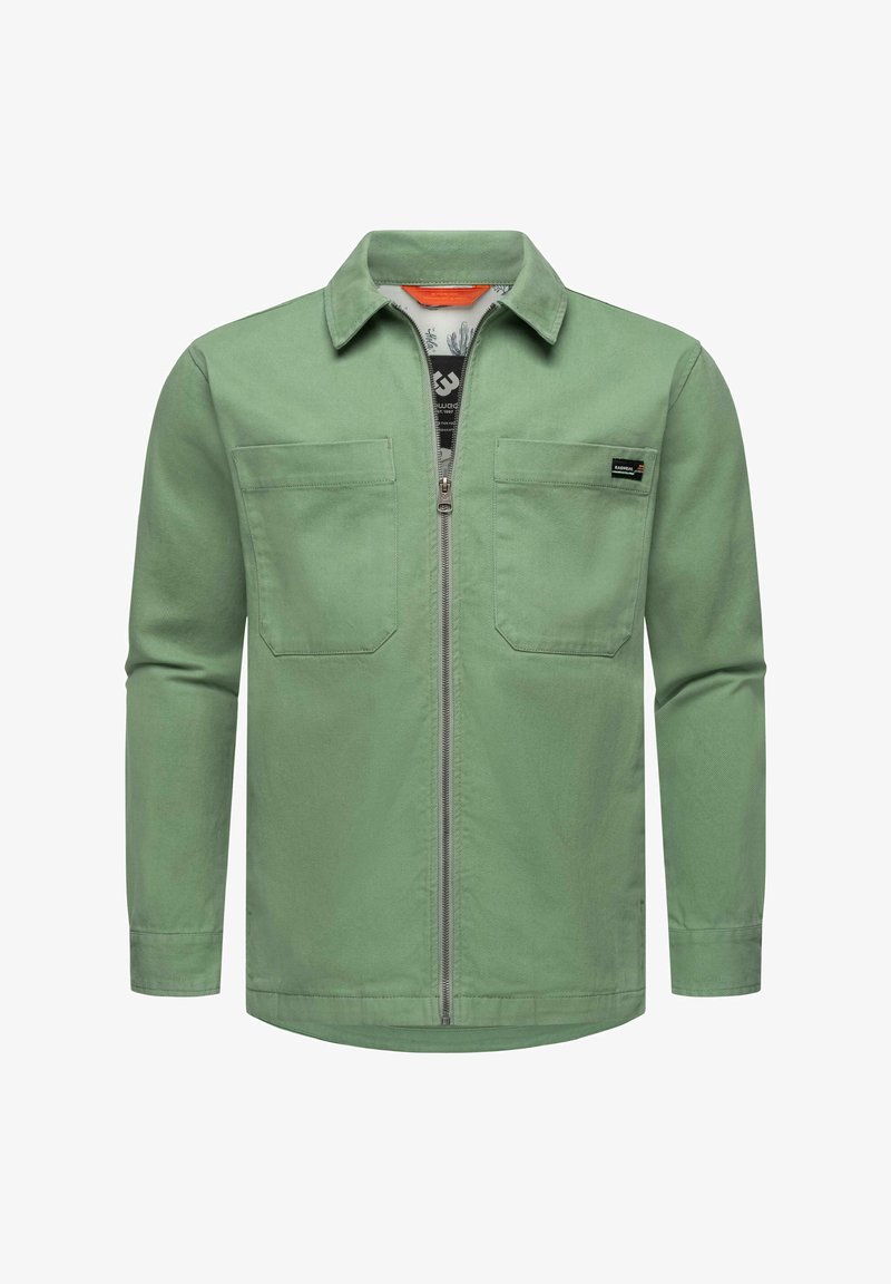 Zelená bunda so zipsom vpredu, dlhými rukávmi, dvoma náprsníkmi a golierom. Vyrobená z hladkej tkaniny so strednou hmotnosťou.