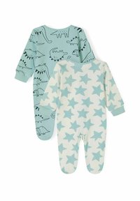 Dos pijamas infantiles: uno azul claro con estampados de dinosaurios negros, el otro color crema con patrones de estrellas azul claro. Material de algodón suave.