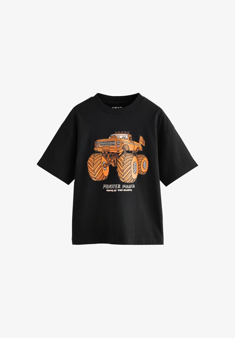 Juoda trumpo rankovio marškinėliai su oranžiniu monstrų sunkvežimio grafiku ir užrašu "Monstrų Manija - Gigantų Namai" priekyje.