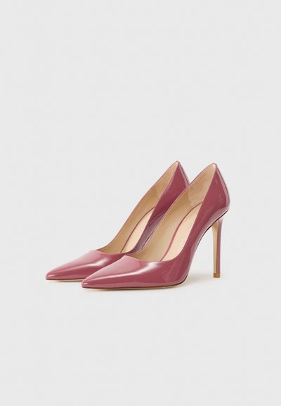 Glossy pink leather high heels with a pointed toe and a thin stiletto heel. Interior features a tan lining and subtle brand detailing.