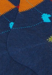 Cotton blend socks in navy blue featuring colorful bird patterns in blue, yellow, and red, with a textured knit finish and reinforced heel.