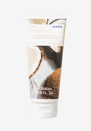 Biała tuba oznaczona "Korres Body Smoothing Milk", z wizualizacjami kokosowymi. Przezroczysta plastikowa nakrętka, wielkość 200 ml, o połyskującym wykończeniu.