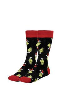 Calzini neri con risvolti e punte rosse, caratterizzati da un motivo ripetitivo di personaggi gialli con accenti bianchi e elementi a tema natalizio.
