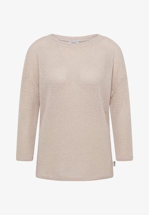 Beżowy, dziergany sweter z długim rękawem, o okrągłym dekolcie i małą białą metką marki na bocznym szwie.