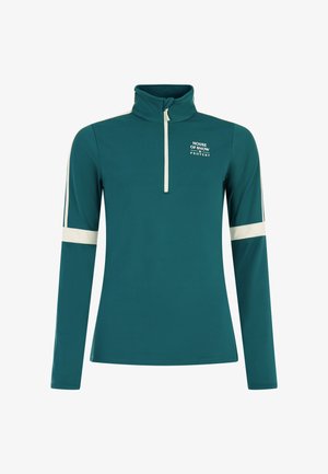 Top de manga larga en color verde azulado con cuello de media cremallera, detalles en blanco en las mangas y un logo impreso en el pecho. Confeccionado en una tela suave y elástica.