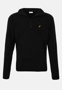 Juodas vilnonis megztinis su pusiau užtrauktuku, ant krūtinės mažas geltonas logotipas, ilgomis rankovėmis ir minkštu, tekstūruotu paviršiumi.