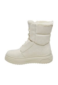 Beige ankelstøvle med en tyk, struktureret sål, faux fur-foring og snørebånd foran. Suede-materiale med polstret krave og diskret branding.